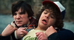 netflixs-stranger-things-season-1-episode-6-the-monster-pee-pants-troy-threatens-dustin-with-a-knife-at-the-quarry1